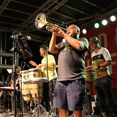 an individual playing a horn instrument