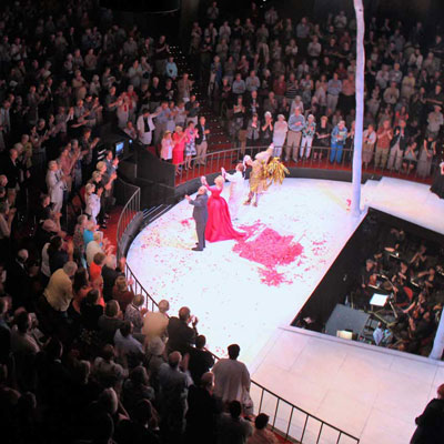image of people bowing on a stage at the end of a performance