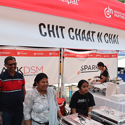 A booth outside that says, "Chit Chaat N Chai". 