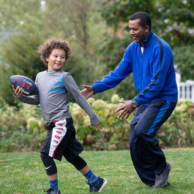 a family playing with a football