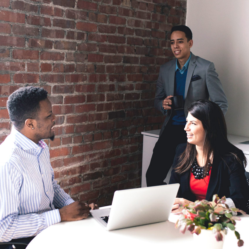 young professionals in a group talking