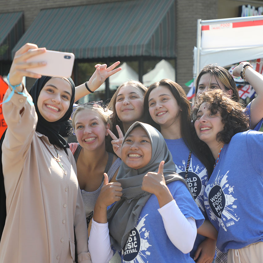 a group of diverse people taking a photo