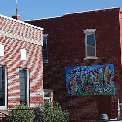A wall with a mural that reads "Osceola"