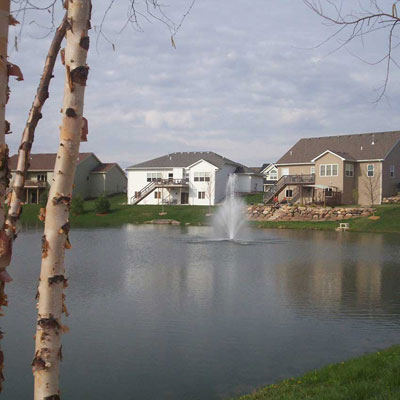 a lake with a view of houses