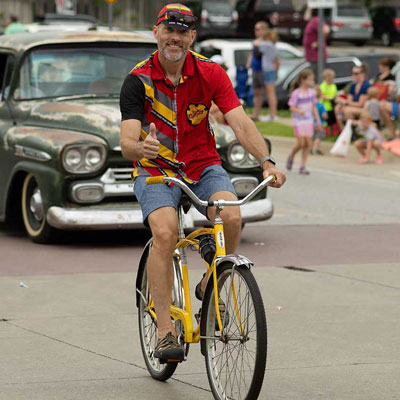 a biker riding through townl