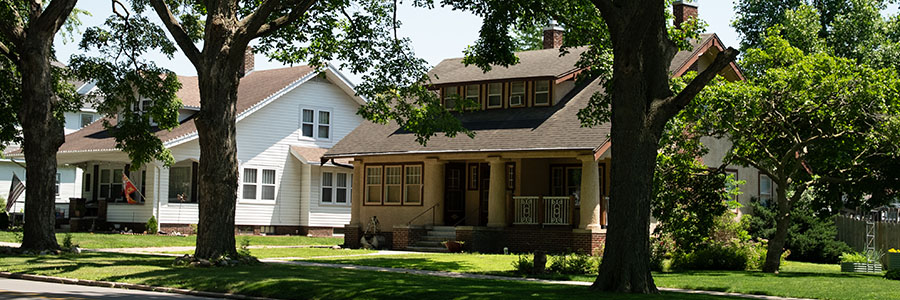 Perry A historical 2 story home on a street with tall trees