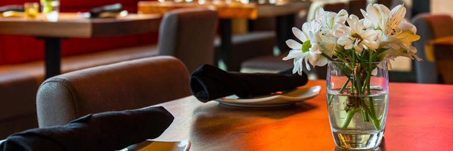 A table set with flowers in the center
