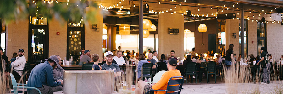 An outdoor patio filled with people