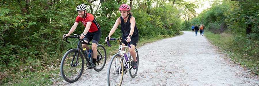 two bikers on a trail two bikers on a trail