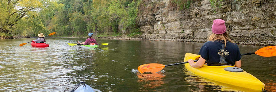 Decorah A group kayaking down a river