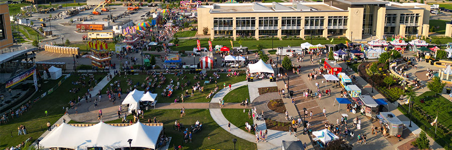 Ankeny SummerFest An overhead view of several tents, stands, rides and stages set up in a town center.