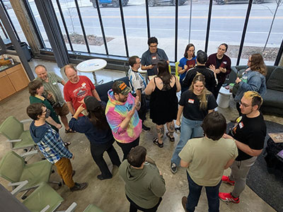 An overhead view of a group of people talking in an open space