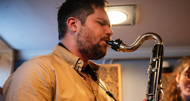 A man playing a reeds instrument.