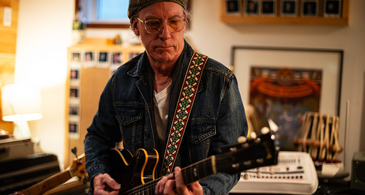 Dave Ducharme-Jones A man playing the guitar
