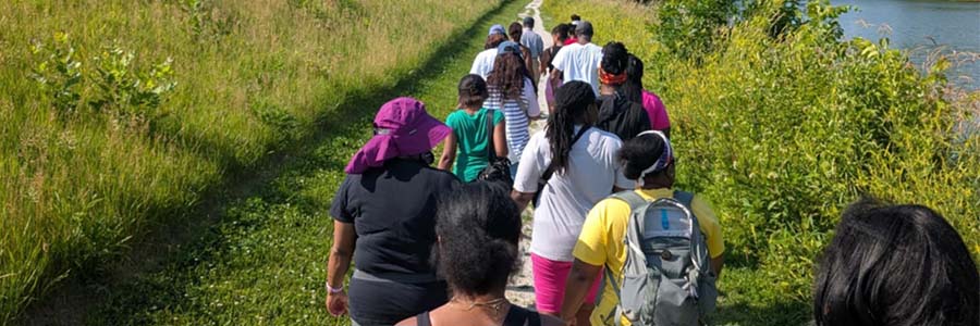 Black Iowa Outdoors A group walking down a path