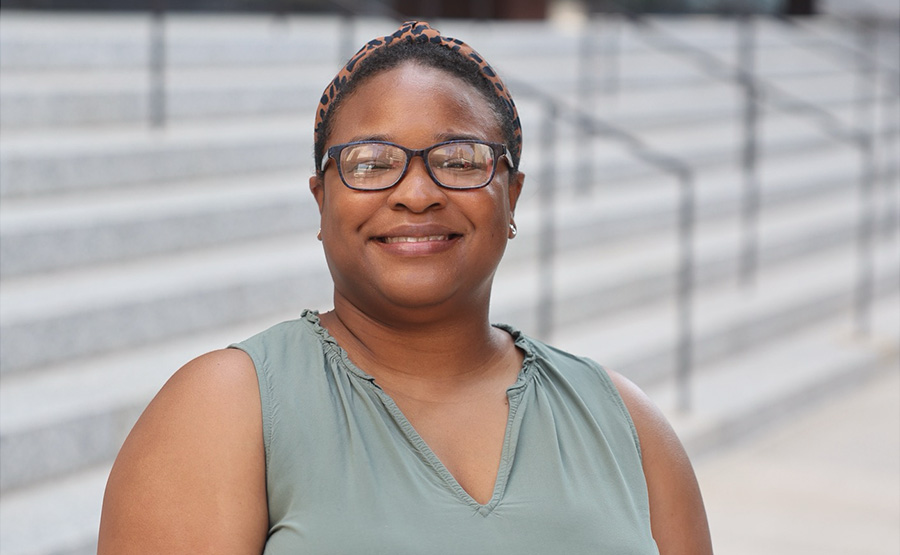 A woman smiling for a photo.