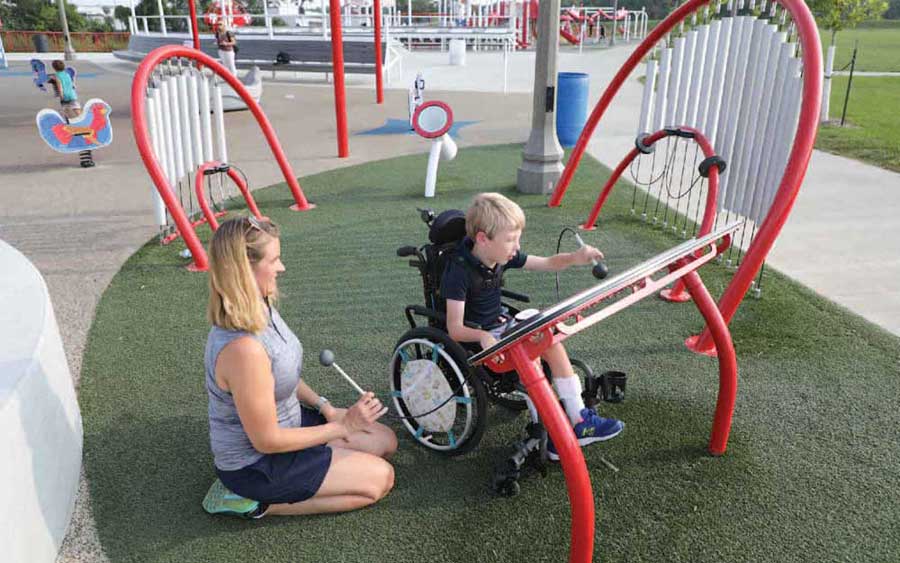 adult and child playing at Riverview Park