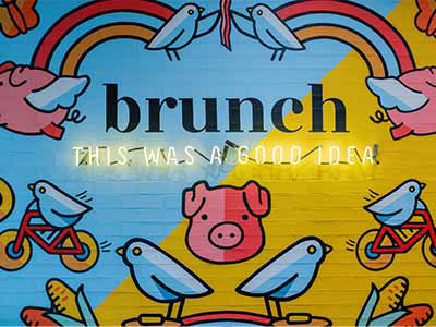 painted wall at Early Bird that says "Brunch, this was a good idea."