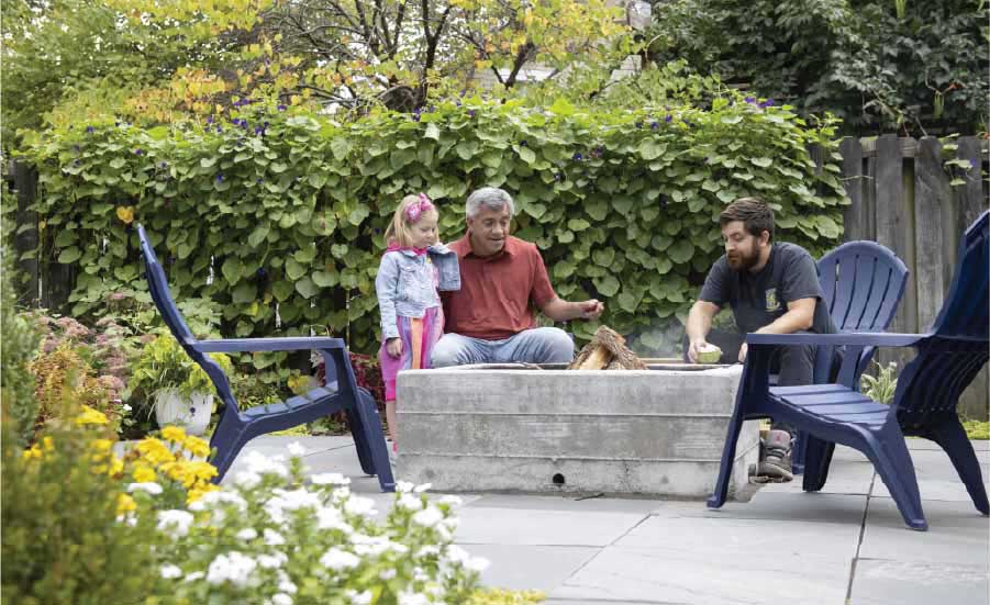 young child with family in backyard